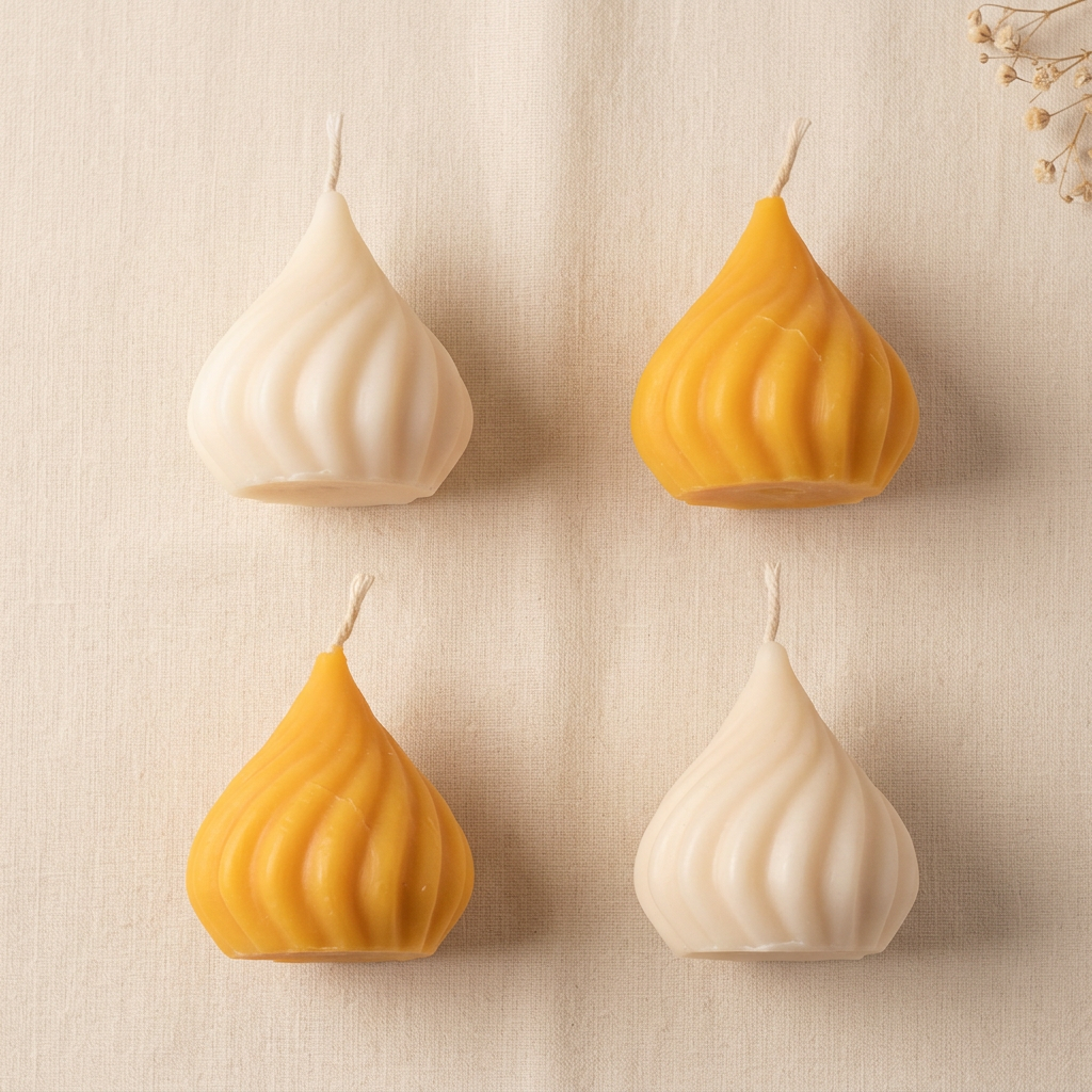 Modak candle pack of four on cream linen